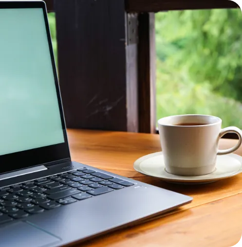 Laptop and coffee on a desk