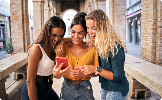 Friends looking at a smartphone together